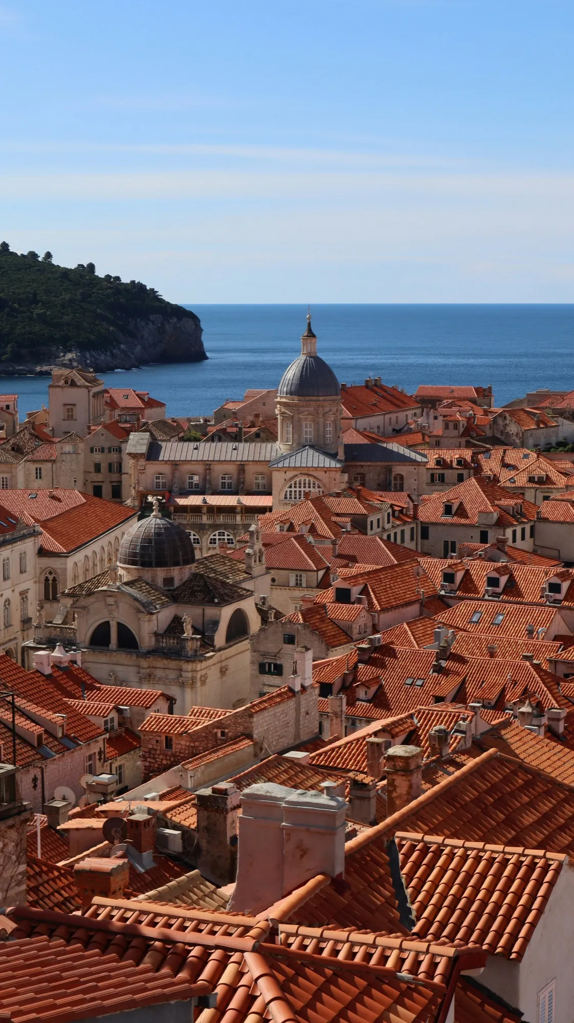 Terracotta rooftops and the cathedral dome of Dubrovnik seen from the city walls