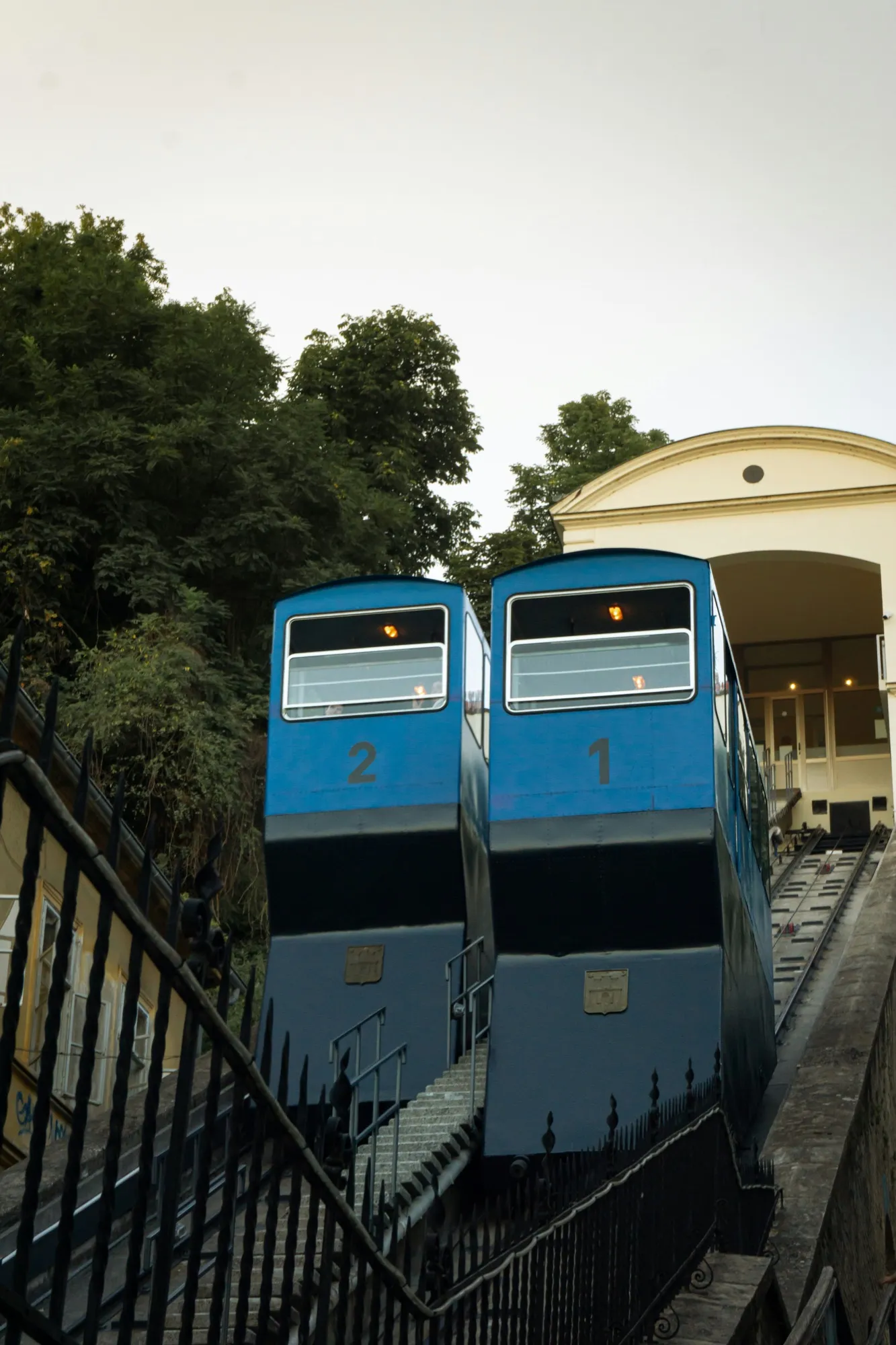 The two blue cars of the Zagreb funicular on their track